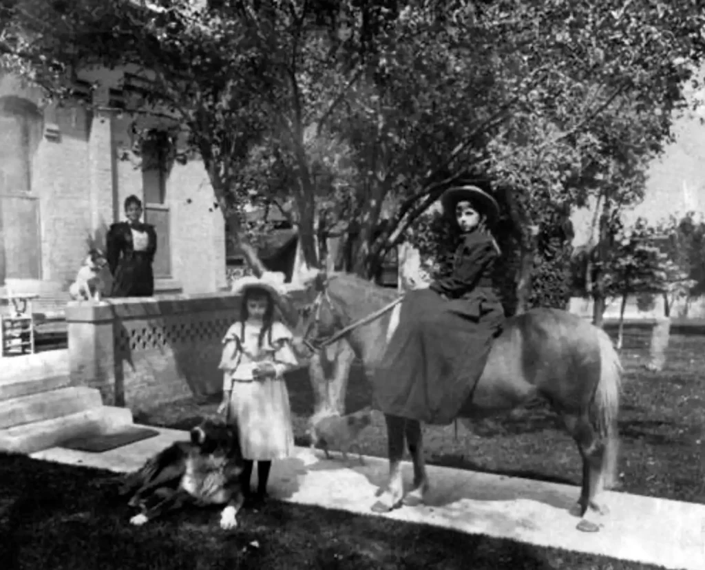 A childhood photo of Anna Reynolds with her dog in Denver.